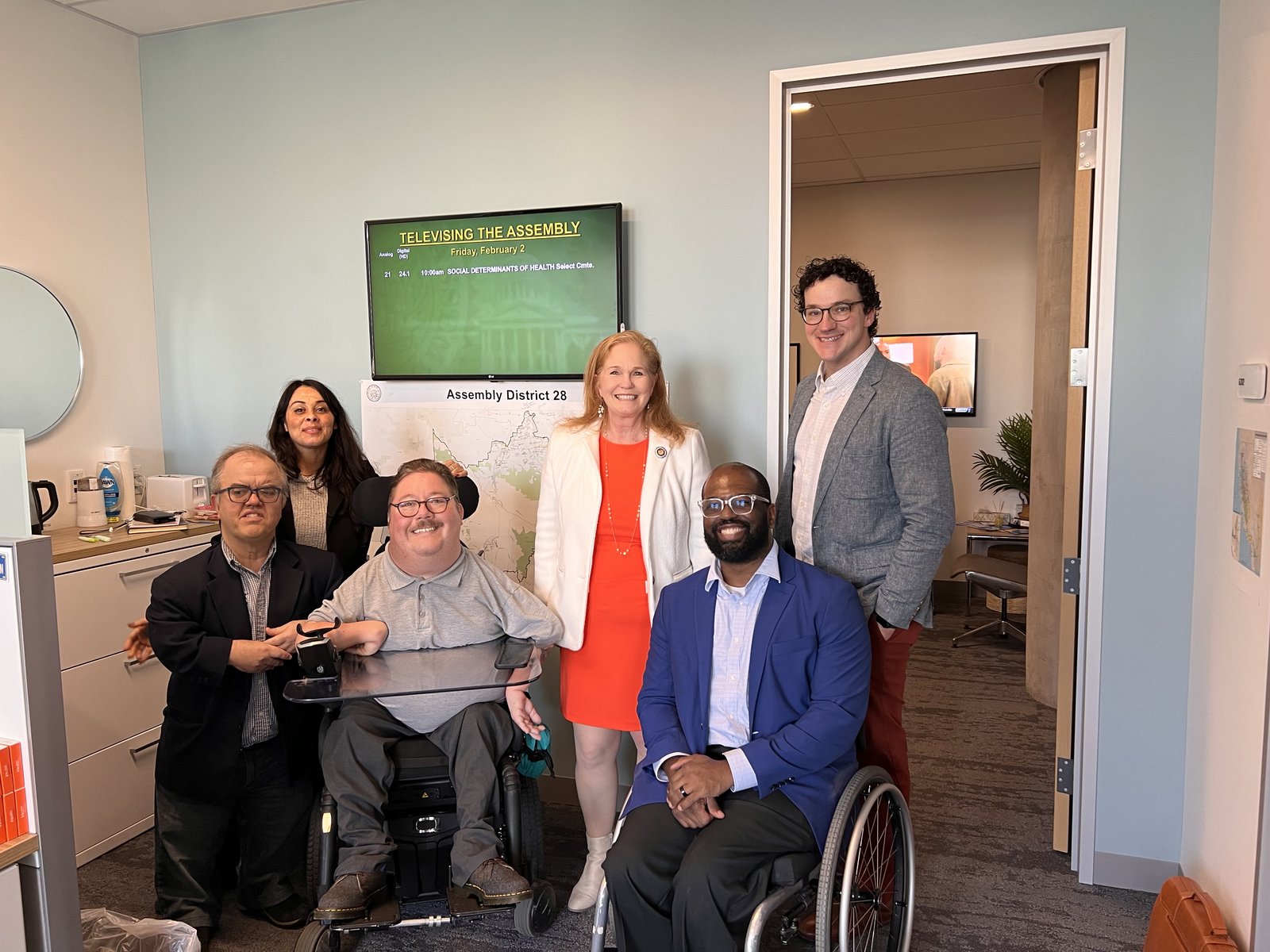 Jimmy Fremgen with Assemblymember Gail Pellerin and disability advocates in her Capitol office